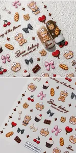 Close-up of 5D embossed nail art stickers featuring cute baker bear and pastry patterns