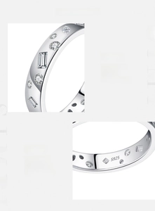 Macro detail of S925 sterling silver ring showing geometric 5A zircon inlay and hallmark