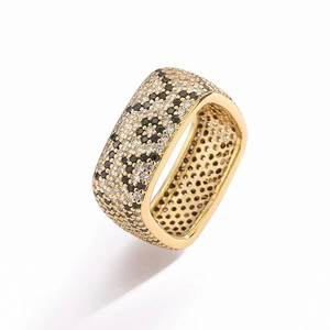 Close-up of square gold ring with leopard pattern pavé zirconia stones and metallic finish