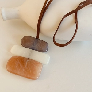 Irregular block pendant necklace with brown marble resin pieces and velvet cord
