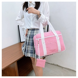 Pink JK uniform bag featuring heart-shaped clear window and matching coin purse