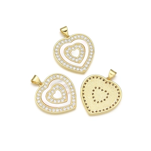 Three heart-shaped gold plated pendants with shell inlay and cubic zirconia stones