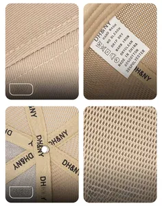 Detail view of cotton mesh cap showing stitching, wash label, and breathable fabric