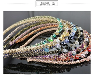 Detailed view of handmade colorful braided crystal headbands with gold thread and beads