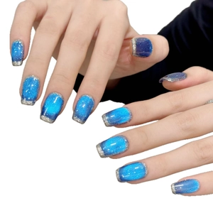 Blue cat eye press-on nails with silver glitter French tips in short square oval shape