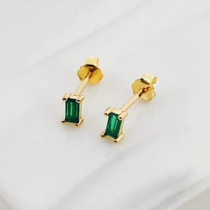 Detail of S925 silver stud earrings featuring rectangular emerald green zircon stones