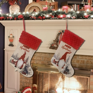 Linen Christmas stockings with Santa gnome hanging on fireplace mantel decoration
