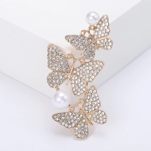 Vintage gold butterfly brooch with shimmering rhinestones and elegant pearls