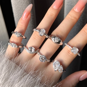 Elegant S925 sterling silver rings with various cubic zirconia stone cuts on a hand