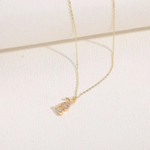 Macro shot of 14K gold-plated rabbit pendant with shimmering zircon pavé details