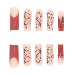 Long coffin press-on nails with dark red French tips, butterfly wings and sparkling rhinestones