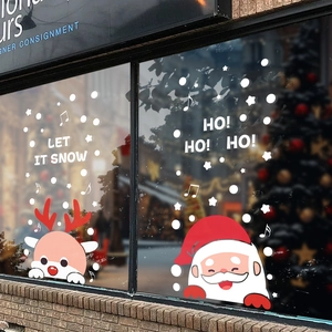 Christmas window stickers with Santa, reindeer and snowflakes on glass window