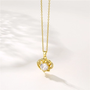 Golden stainless steel necklace featuring a heart pendant with a sparkling zircon center