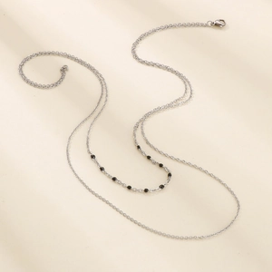 Double-layered silver cross chain necklace with black resin beads and lobster clasp