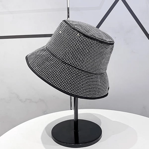 Detailed view of silver rhinestones fully covering a black disco bucket hat