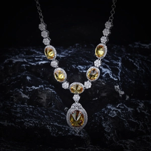 Macro view of sterling silver necklace with champagne oval gemstones and micro diamonds