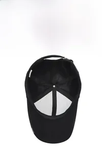 Detail view of the breathable inner lining and adjustable metal buckle on black baseball cap