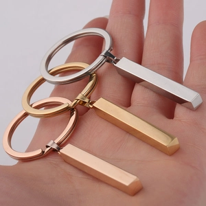Minimalist stainless steel bar keychains in silver, gold, and rose gold finishes