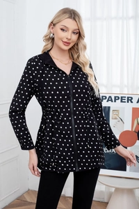 Close-up of black hooded jacket with white polka dots featuring waist drawstring detail