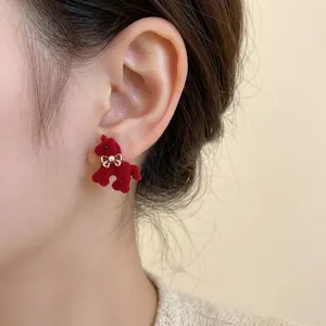 Red flocked poodle earrings with pearl bow detail for women in retro style