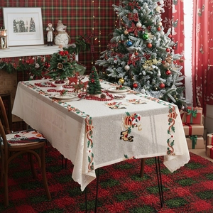 Festive Christmas tablecloth with Santa and reindeer embroidery on cream fabric