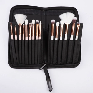 Detailed view of black foldable makeup brush organizer with various brushes neatly arranged