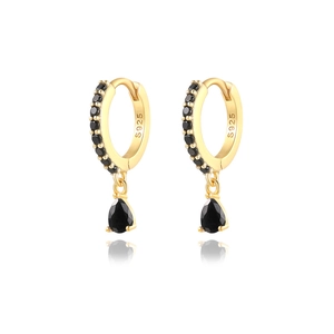 Detailed macro view of S925 sterling silver stamp on gold drop earrings with black stones