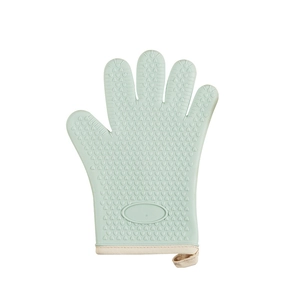 Light green silicone oven mitt with anti-slip heart texture and hanging loop on white background