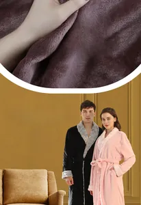 Detailed close-up of thick flannel bathrobe fabric texture and side pocket design