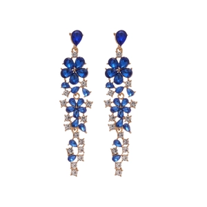 Elegant gold flower tassel earrings with blue gemstones and crystals on white background