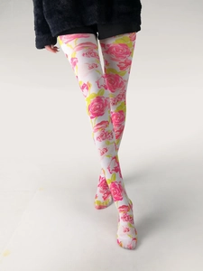 Detail of floral printed tights featuring pink roses and yellow leaves on white fabric