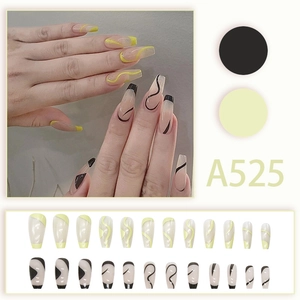 Dual-color coffin press-on nails featuring yellow waves and black linear patterns