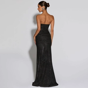 Detailed back view of sleek black off-shoulder sequin evening dress with silver shimmer