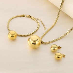 Detailed view of the 18K gold plated jewelry set featuring snake chains and round bead accents