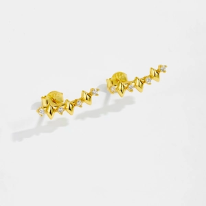 Close-up of gold s925 silver wave earrings with clear zircons and 925 hallmarks