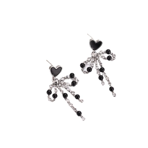 Copper heart bow stud earrings with black tassels and rhinestones on white background