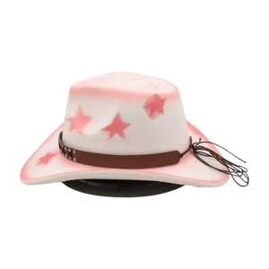 Detail of pink star pattern and brown leather belt with metal studs on white cowboy hat