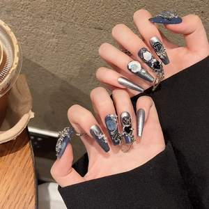 Handmade press-on nails in deep blue with gothic roses, pearls, and silver chains
