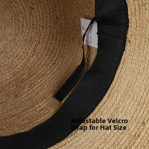 Detail of raffia hat interior with adjustable velcro strap and black sweatband