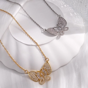 Elegant butterfly pendant necklaces in gold and silver with shimmering cubic zirconia