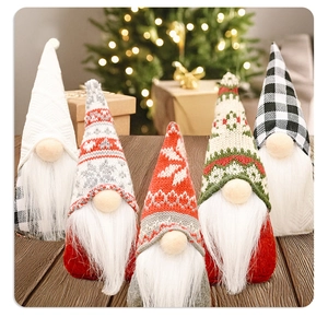 Five assorted Christmas gnomes with knitted hats on a rustic wooden surface