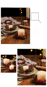 Close-up of beige candle with red berries and pine cone Christmas wreath decor