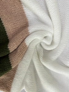 Soft knit sweater in color-block white, dark green, and camel with fluffy texture