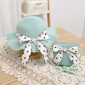 Matching straw hat and crossbody bag set in mint green with polka dot ribbon bows