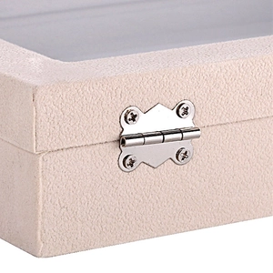 Macro view of silver metal hinges on a beige textured leather jewelry storage box