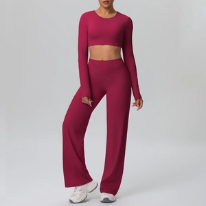 Detail of burgundy long sleeve crop top and high waist wide leg yoga pants set