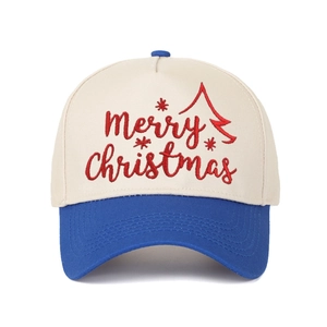 Detail showing red Merry Christmas embroidery on a blue and off-white twill baseball cap