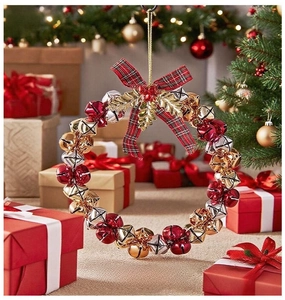 Close-up of Christmas bell wreath with plaid bow and berries in festive setting