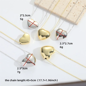 Minimalist heart pendant necklace in gold and silver finish with size specifications