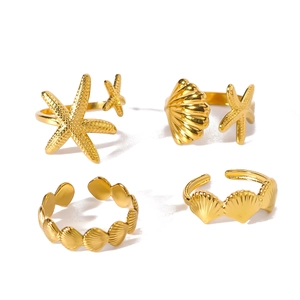 Four-piece set of golden starfish and seashell open rings for summer beach style